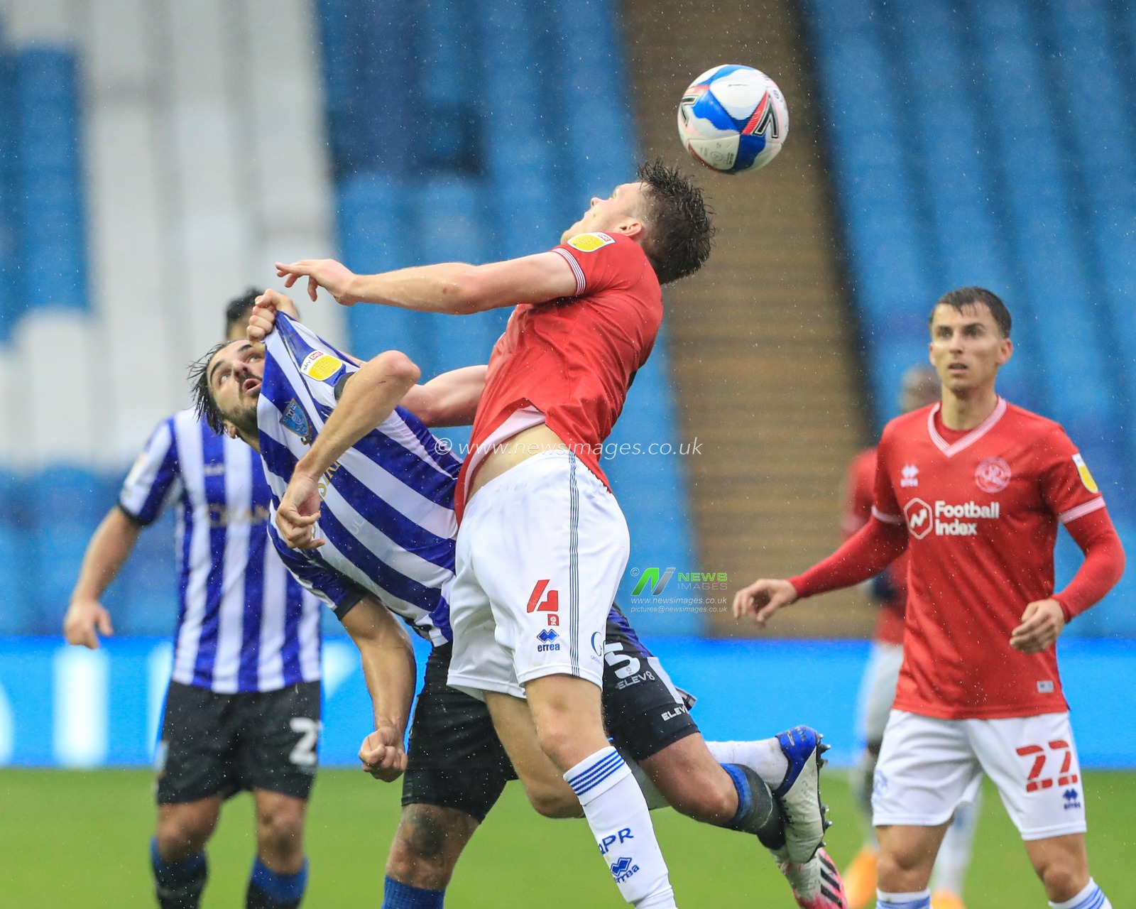 Callum Paterson (5) of Sheffield Wednesday  is pulled off the ball by Rob Dickie (4) of Queens Park rangers