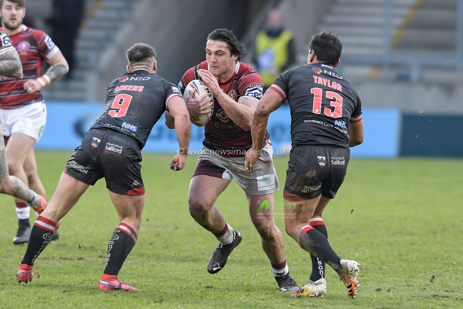 Liam Byrne (19) of Wigan Warriors runs forward with the ball