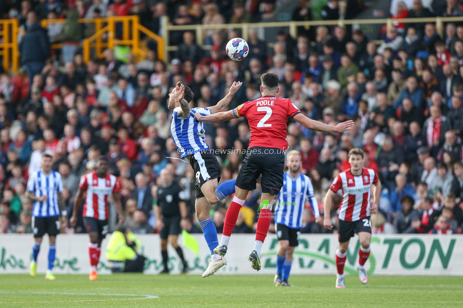 Lee Gregory #9 of Sheffield Wednesday and Regan Poole #2 of Lincoln City challenge for a header during the Sky Bet League 1 match Lincoln City vs Sheffield Wednesday at Gelder Group Sincil Bank Stadium, Lincoln, United Kingdom, 22nd October 2022

(Photo by Arron Gent/News Images)