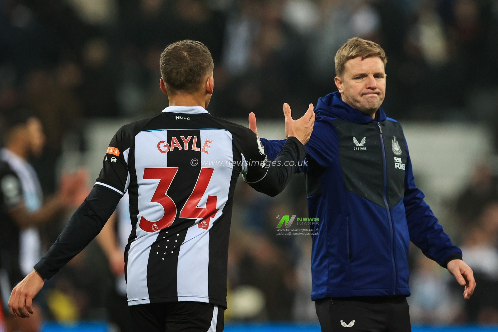 Eddie Howe manager of Newcastle United and Dwight Gayle #34 shake hands at the end of the game