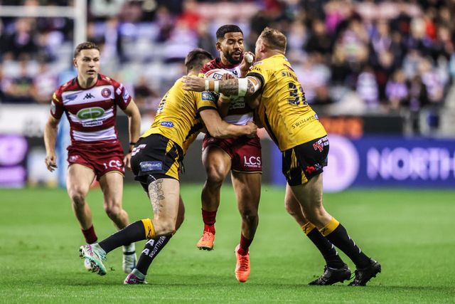 ﻿Kruise Leeming of Wigan Warriors is tackled by Sam Wood of Castleford Tigers and Brad Singleton of Castleford Tigers during the Betfred Super League Round 26 match Wigan Warriors vs Castleford Tigers at The Brick Community Stadium, Wigan, United Kingdom, 12th September 2025

(Photo by Alfie Cosgrove/News Images)