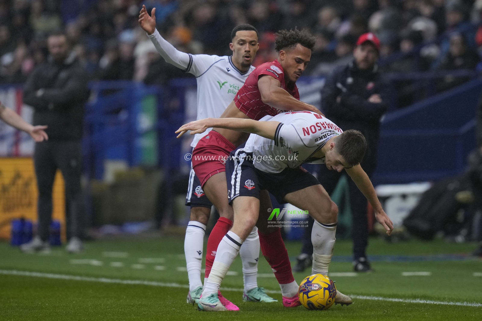 Elliot Bonds of Cheltenham Town competes for the ball with George Thomason of Bolton Wanderers during the Sky Bet League 1 match Bolton Wanderers vs Cheltenham Town at Toughsheet Community Stadium, Bolton, United Kingdom, 13th January 2024

(Photo by Steve Flynn/News Images)