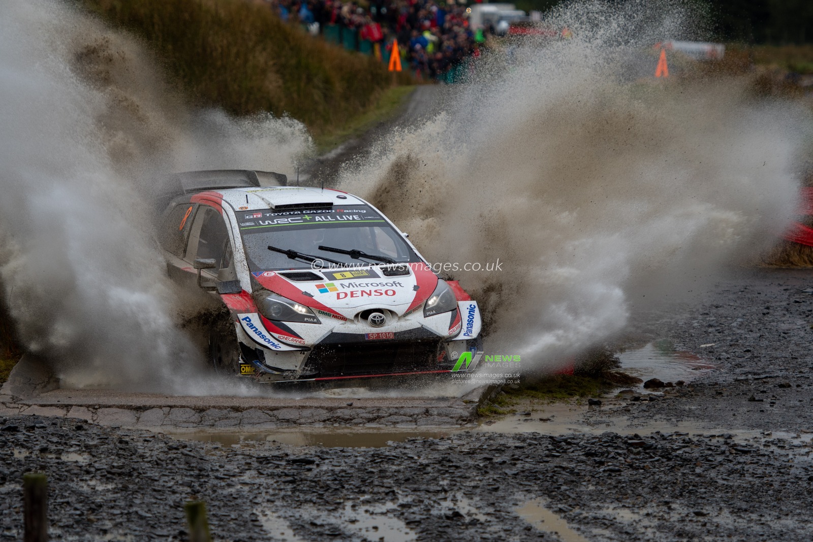 5th October 2019, Wales ; SS13 Sweet Lamb Hafren, Wales Rally GB 2019 Stage 13: Ott TANAK & Co Driver Martin JERVEOJA competing in the Toyota Yaris WRC for Toyota Gazoo Racing WRT leaves the water splash at Sweet Lamb

Credit: Gareth Dalley/News Images