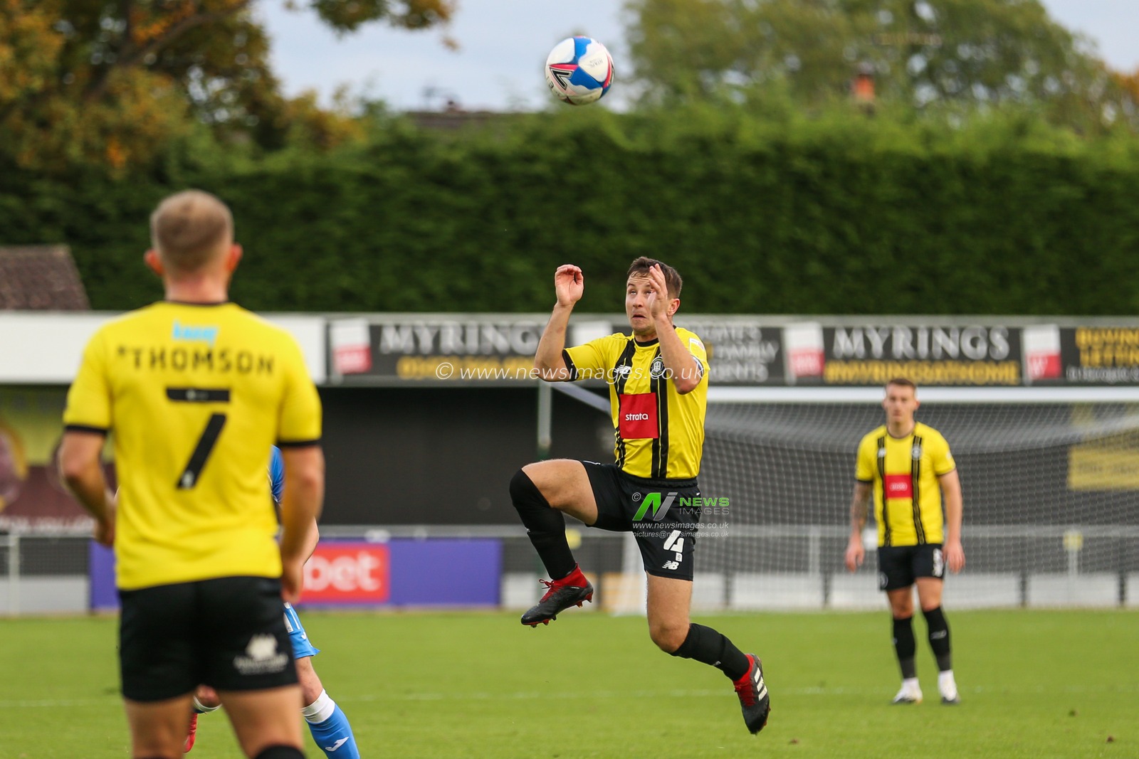 Josh Falkingham (4) of Harrogate Town jumps for the high ball