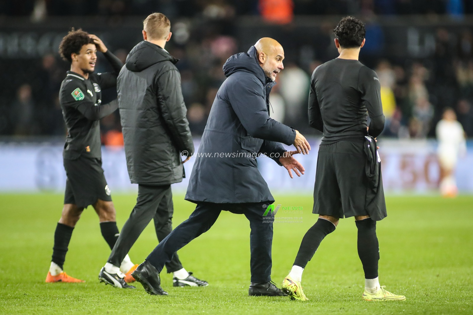 Manchester City Manager Pep Guardiola and Omar Marmoush of Manchester City at the final whistle during the Carabao Cup Last 16 Swansea City vs Manchester City at Swansea.com Stadium, Swansea, United Kingdom, 29th October 2025

(Photo by Andrew Lewis/News Images)

*** GER AUT SUI OUT ***