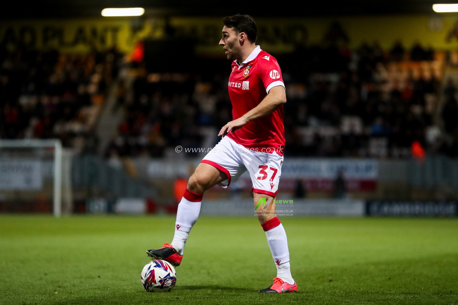 Matthew James of Wrexham AFC runs with the ball during the Sky Bet League 1 match Cambridge United vs Wrexham at Abbey Stadium, Cambridge, United Kingdom, 1st April 2025

(Photo by Izzy Poles/News Images)