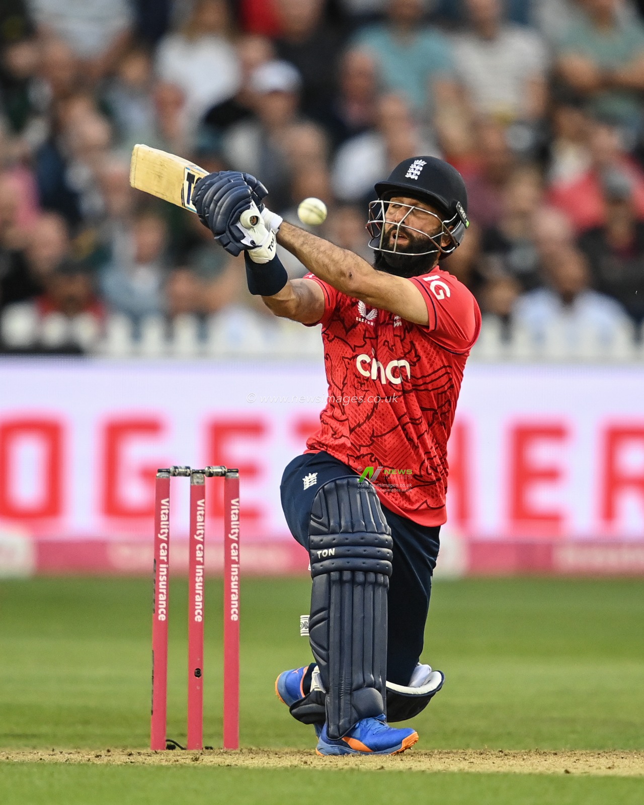 Moeen Ali of England hits a shot and is caught behind by Quinton De Kock of South Africa