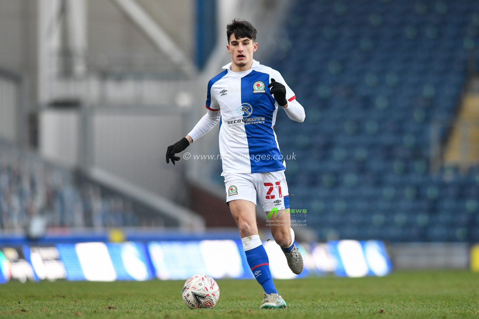 John Buckley #21 of Blackburn Rovers runs with the ball
