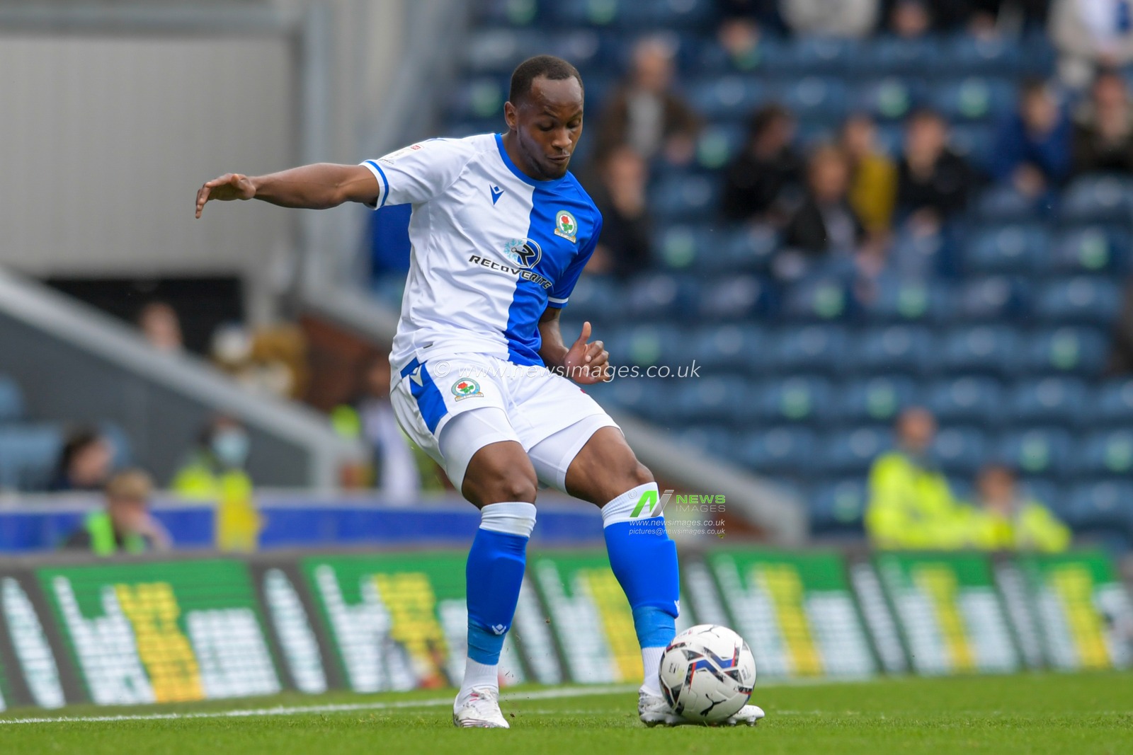 Ryan Nyambe #2 of Blackburn Rovers passes the ball