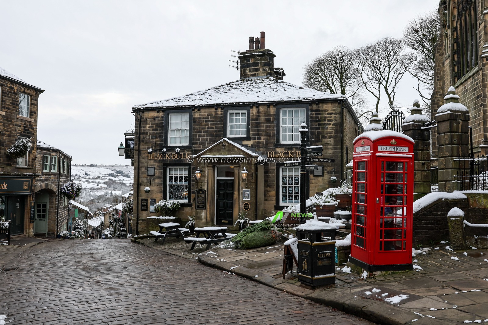 Snow falls in the square near the Black Bull pub in Haworth also know as Bronte Country, Howarth, United Kingdom, 19th November 2024

(Photo by Mark Cosgrove/News Images)