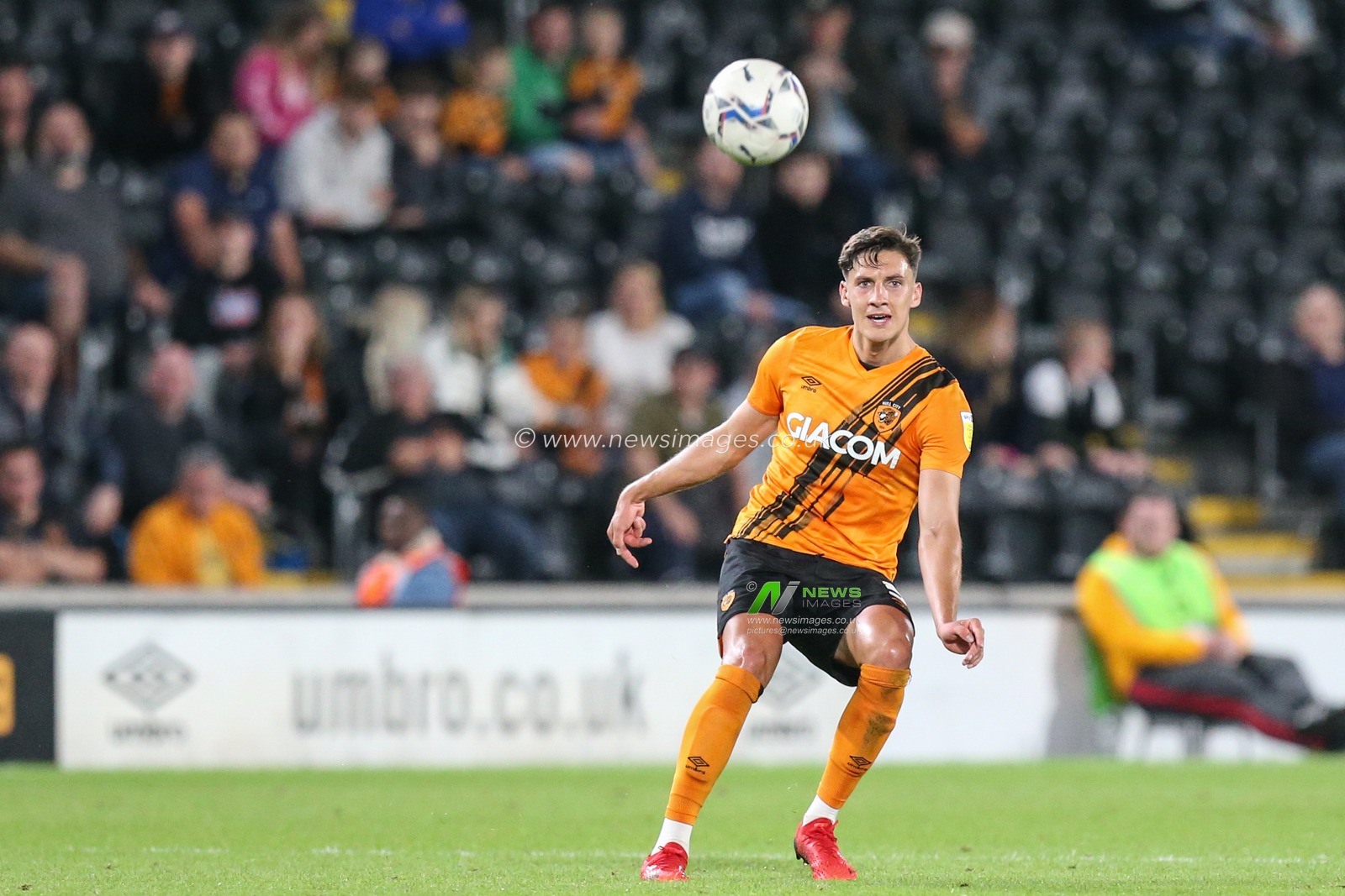 Alfie Jones #5 of Hull City passes the ball