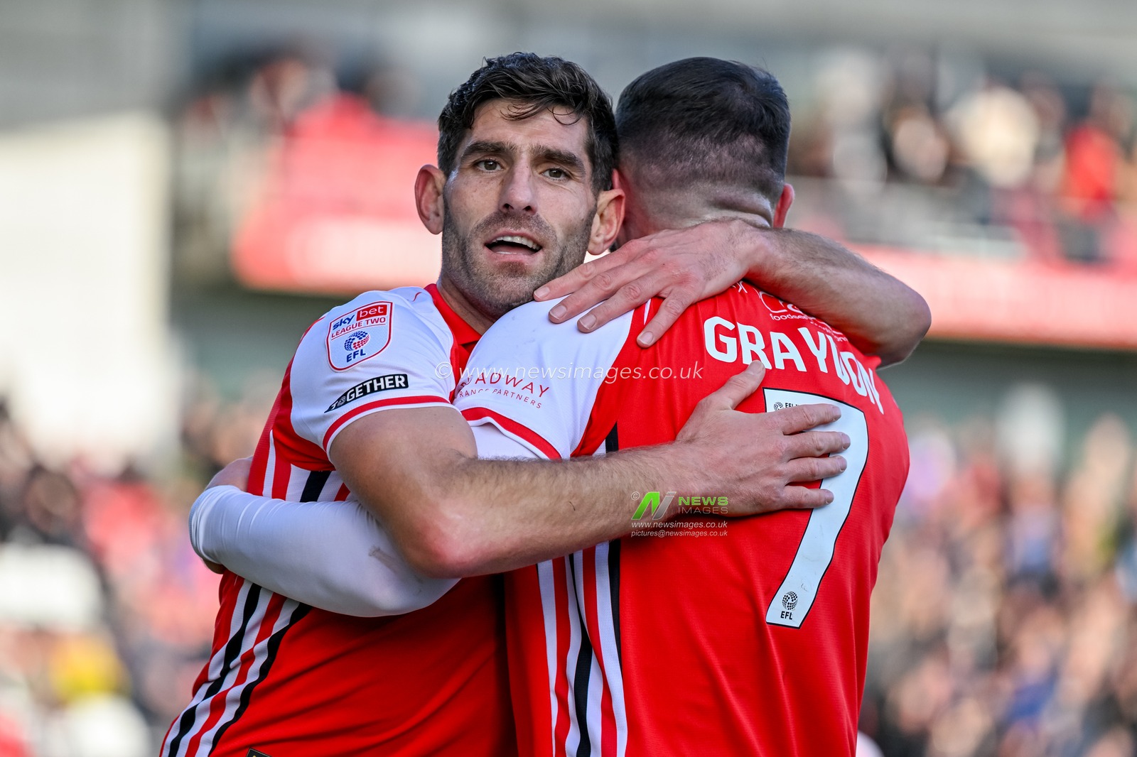 Ched Evans of Fleetwood Town  celebrates with Ryan Graydon after the thrid Fleetwood goal 3-2 during the Sky Bet League 2 match Fleetwood Town vs Harrogate Town at Highbury Stadium, Fleetwood, United Kingdom, 11th October 2025

(Photo by Adam Gee/News Images)