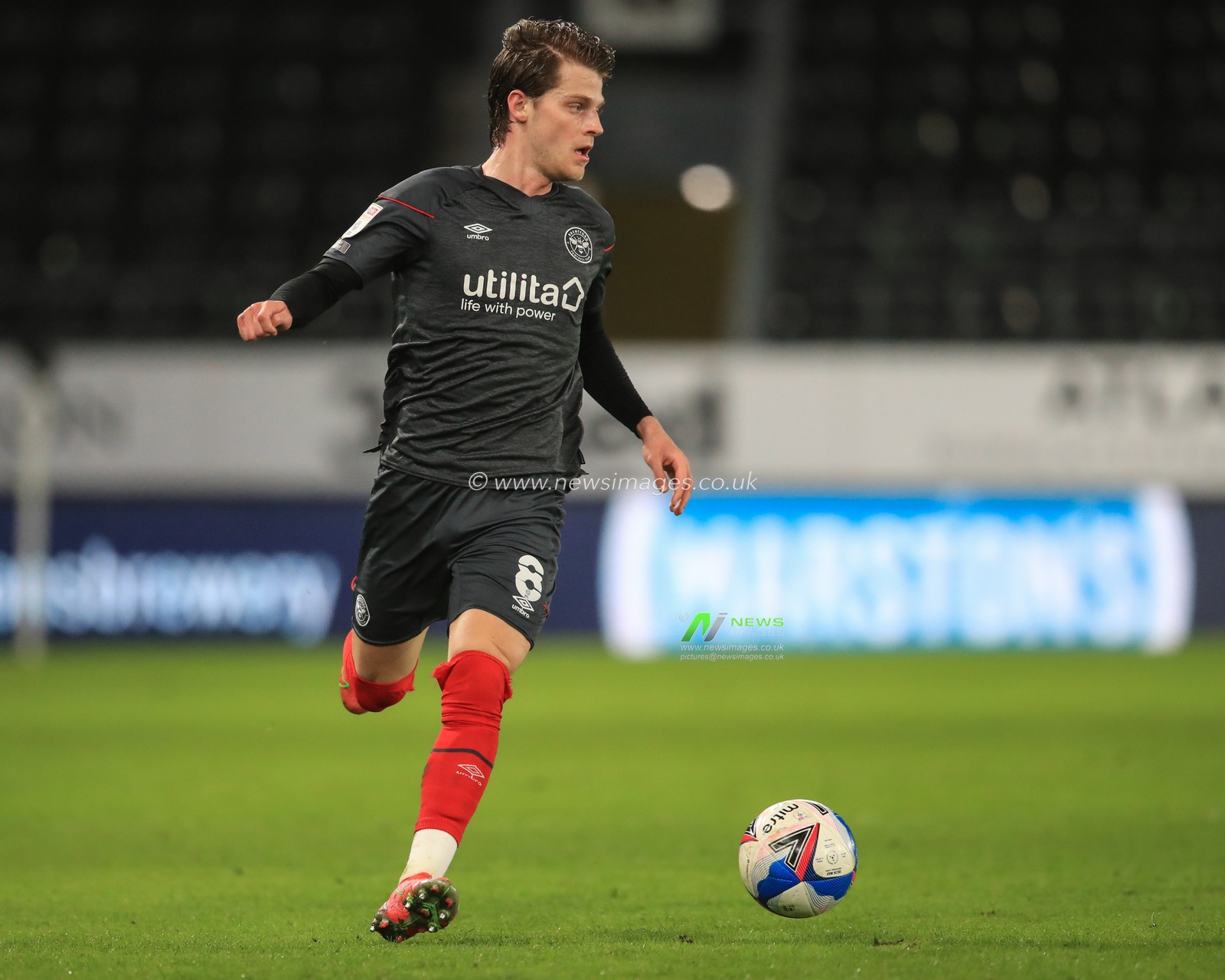 Mathias Jensen #8 of Brentford in action during the game