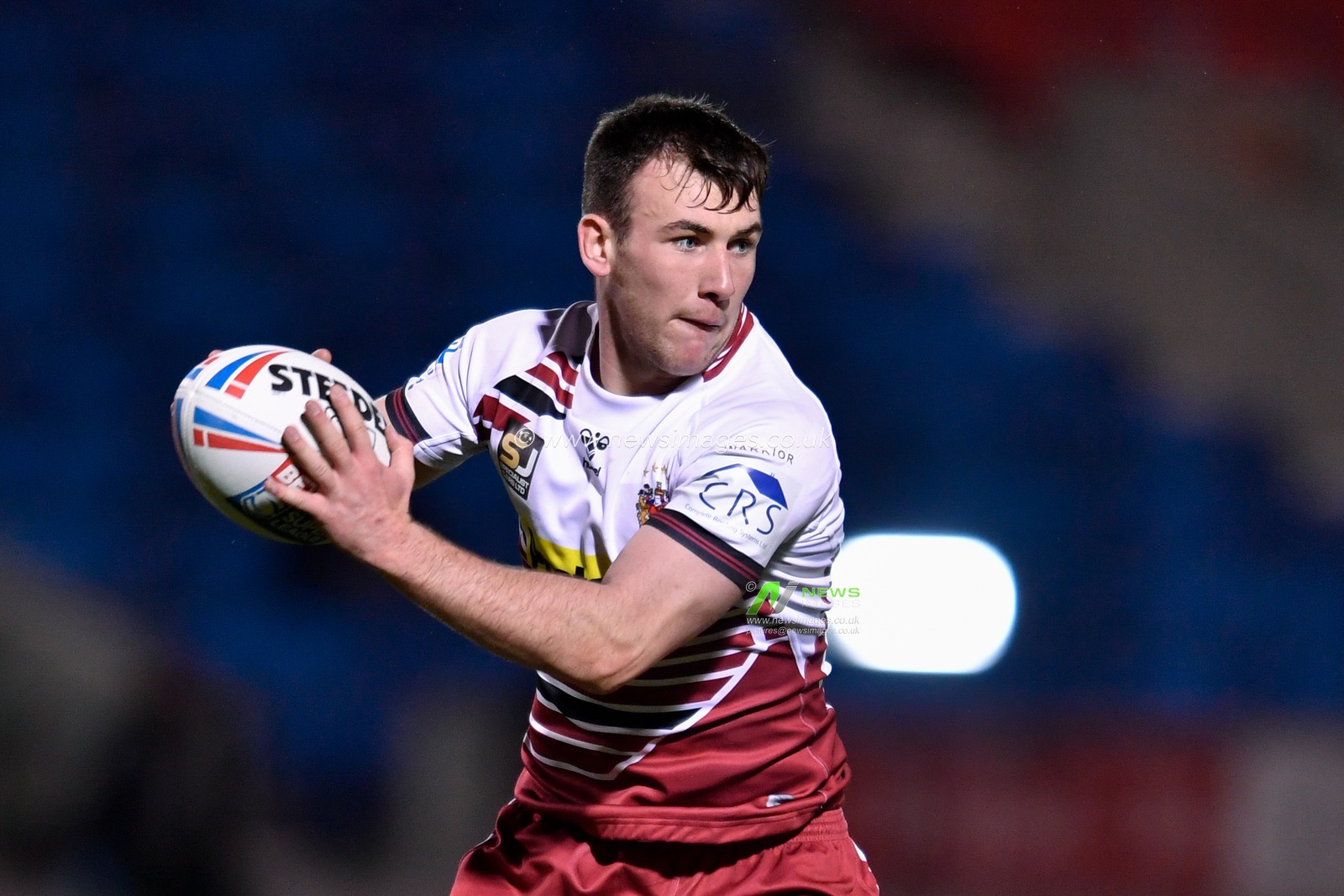 Harry Smith (28) of Wigan Warriors looks for a pass
