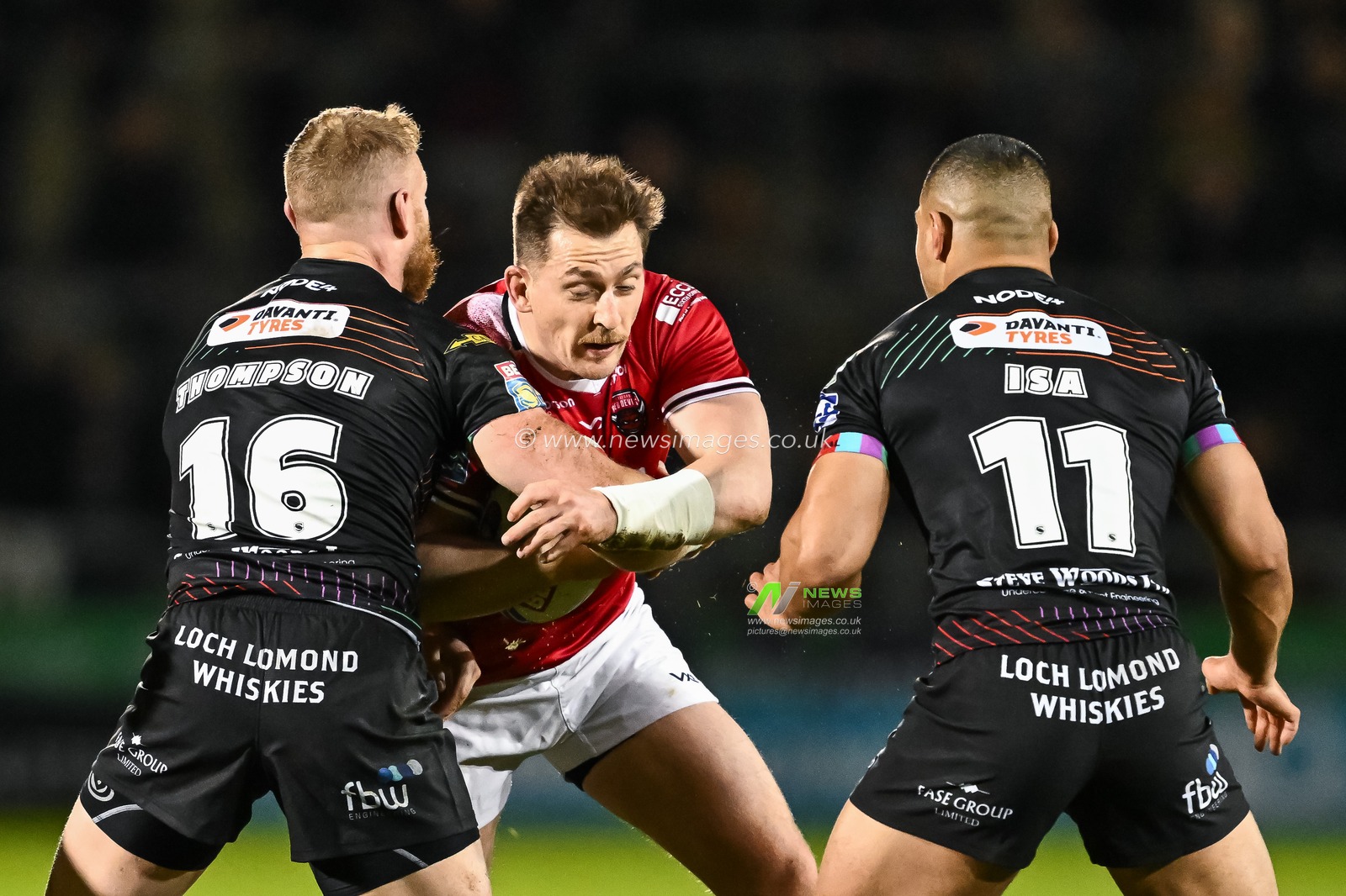 Andrew Dixon of Salford Red Devils is tackled by Luke Thompson of Wigan Warriors  during the Betfred Super League Round 5 match Salford Red Devils vs Wigan Warriors at Salford Community Stadium, Eccles, United Kingdom, 14th March 2024

(Photo by Craig Thomas/News Images)