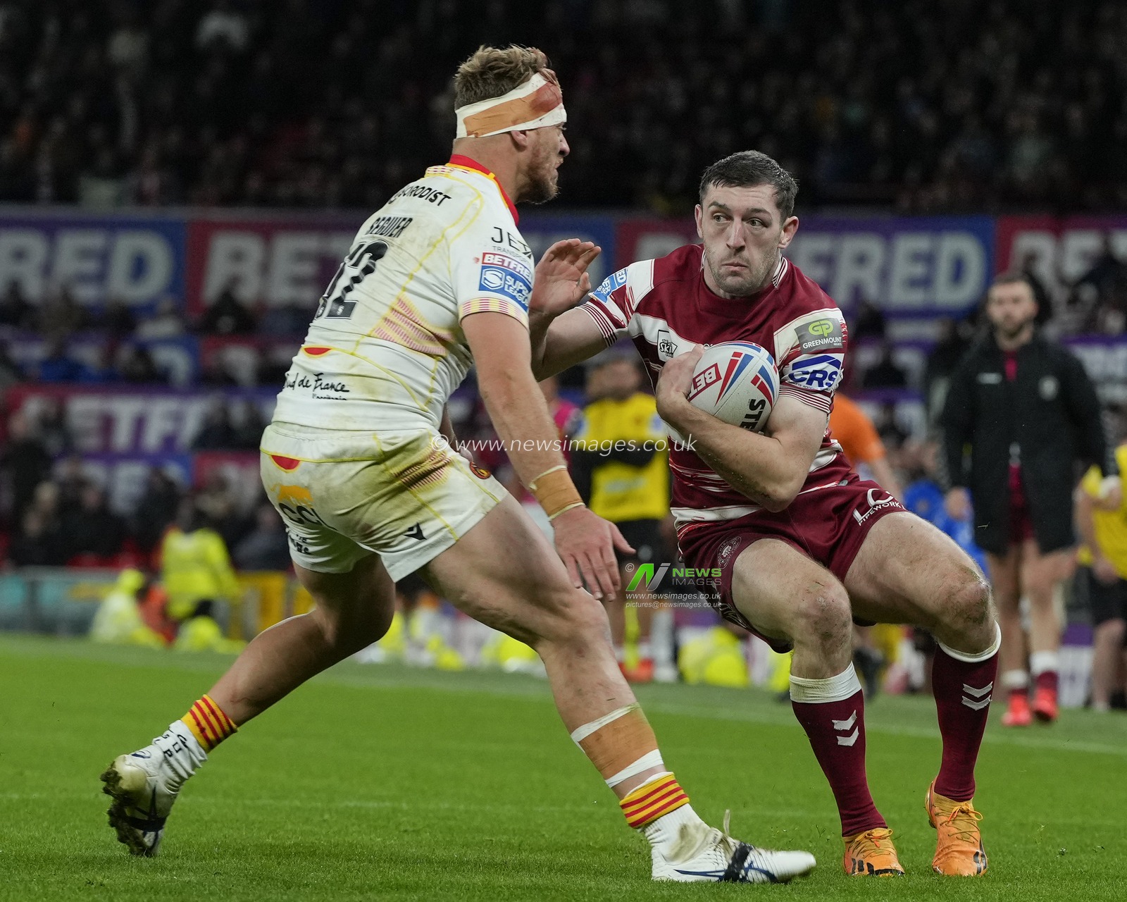 Jake Wardle #4 of Wigan Warriors runs at Paul Seguier #12 of Catalans Dragons during the Betfred Super League Grand Final match Wigan Warriors vs Catalans Dragons at Old Trafford, Manchester, United Kingdom, 14th October 2023

(Photo by Steve Flynn/News Images)