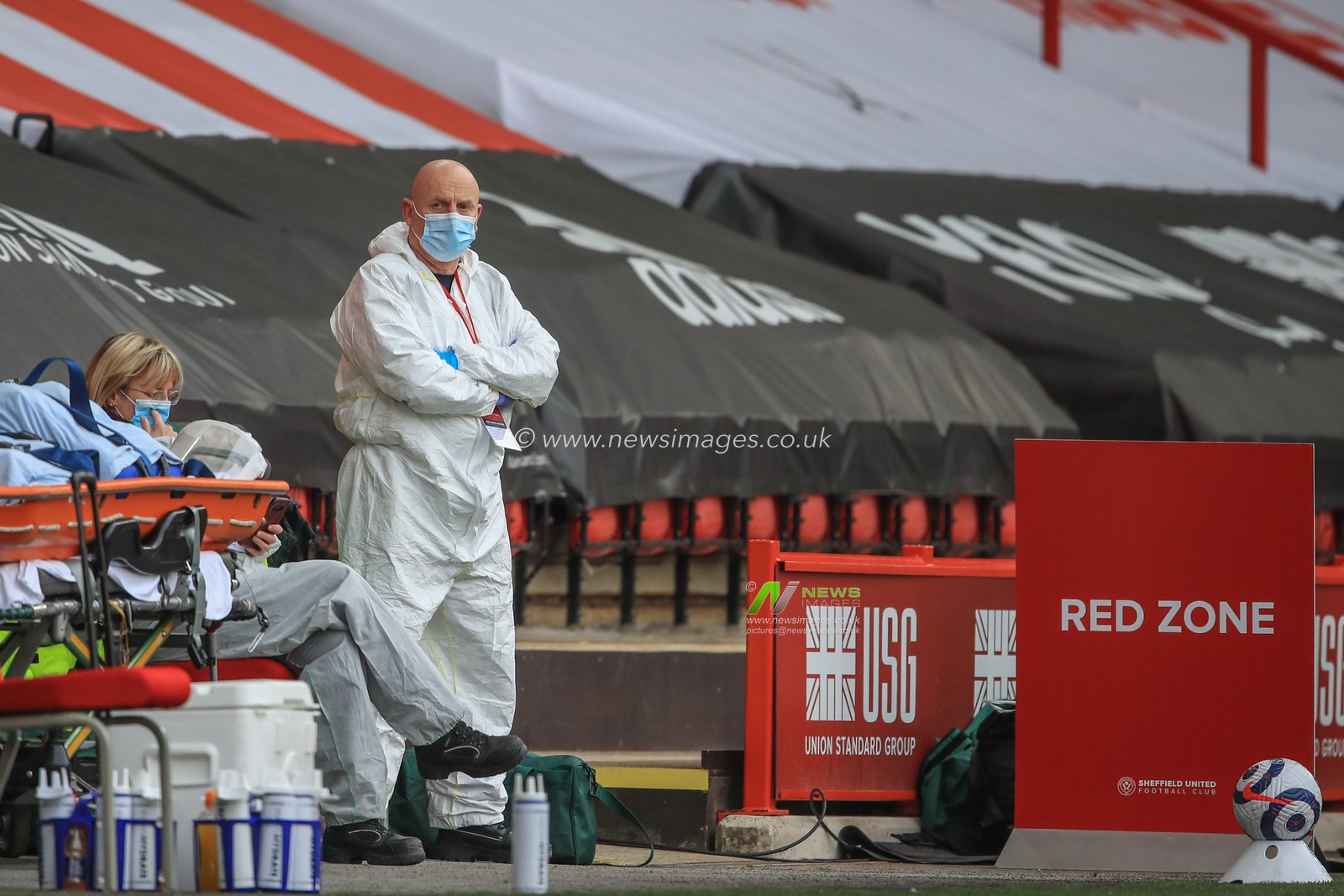 Emergency staff dressed in white over suits in the red zone at Bramall Lane