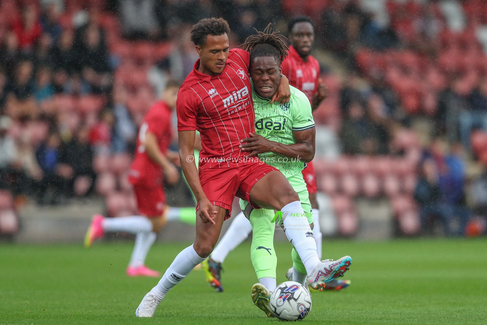 Elliot Bonds #23 of Cheltenham Town and Brandon Thomas-Asante #21 of West Bromwich Albion battle for the ball during the Pre-season friendly match Cheltenham Town vs West Bromwich Albion at The Completely-Suzuki Stadium, Cheltenham, United Kingdom, 18th July 2023

(Photo by Gareth Evans/News Images)