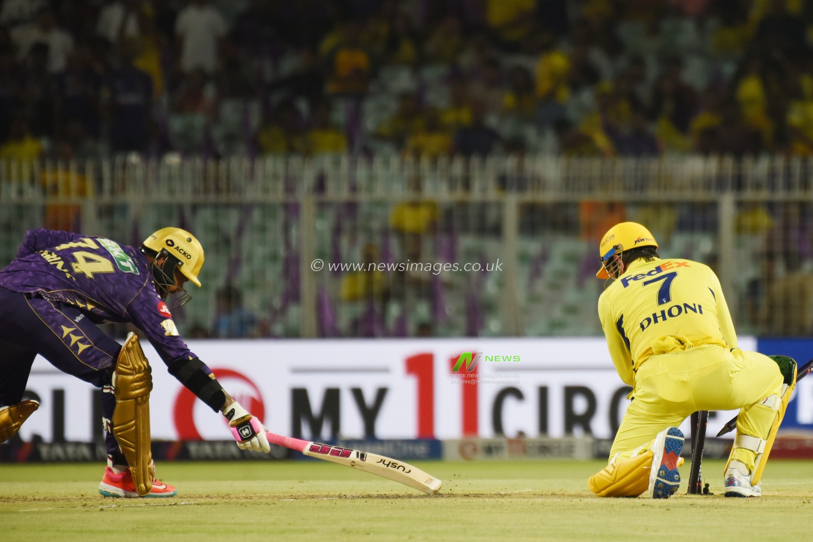 Chennai Super Kings' captain Mahendra Singh Dhoni, right, breaks the stumps to dismiss Kolkata Knight Riders' Sunil Narine, left,during the 2025 IPL match between Kolkata Knight Riders and Chennai Super Kings at Eden Gardens on May 07, 2025, in Kolkata, India. Photo by Debajyoti Chakraborty.(Photo: Debajyoti Chakraborty/News Images)