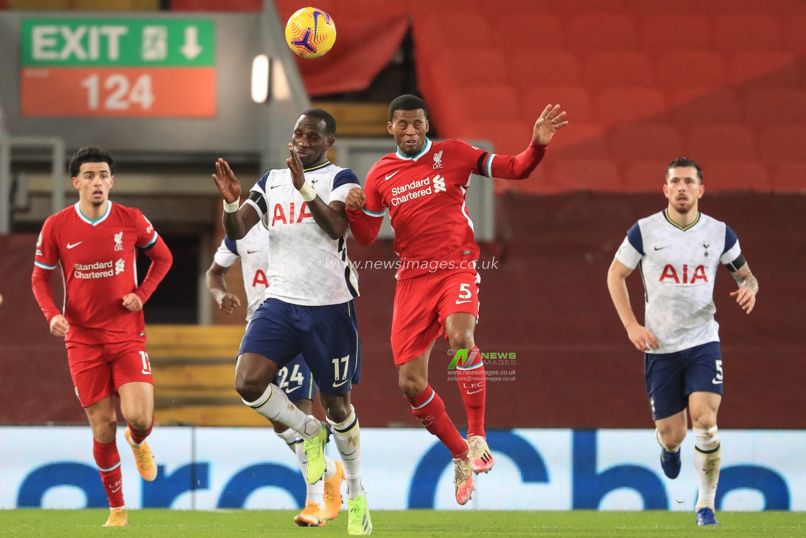 Georginio Wijnaldum #5 of Liverpool and Moussa Sissoko #17 of Tottenham Hotspur dual for the ball