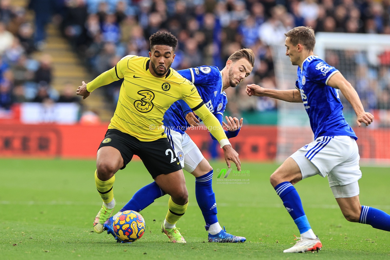Reece James #24 of Chelsea is tackled by James Maddison #10 of Leicester City
