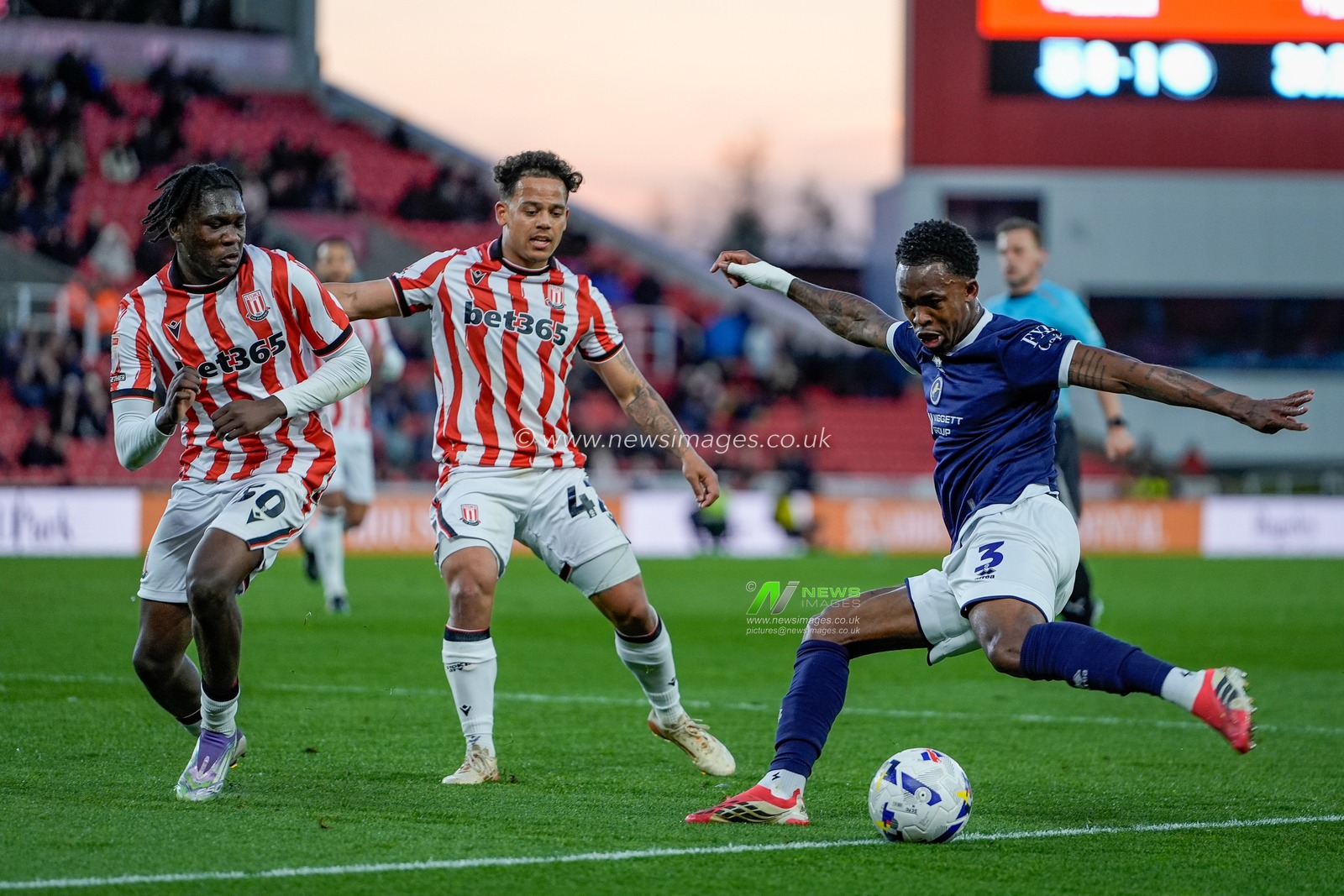 Zak Sturge of Millwall dribbles the ball to beat Million Manhoef of Stoke City and Sydney Agina of Stoke City during the Sky Bet Championship match Stoke City vs Millwall at Bet365 Stadium, Stoke On Trent, United Kingdom on 21 April 2026

(Photo by Maynard Manyowa/News Images)