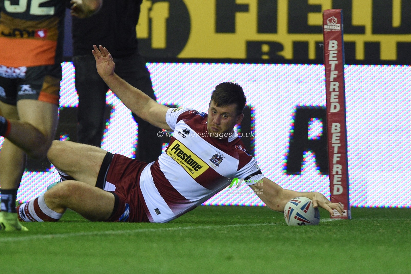 12th September 2019 , DW Stadium, Wigan, England;  Betfred Super League Rugby, Round 29, Wigan Warriors vs Castleford Tigers ; Joe Greenwood (11) of Wigan Warriors scores a try making it 14-2

Credit: Richard Long/News Images