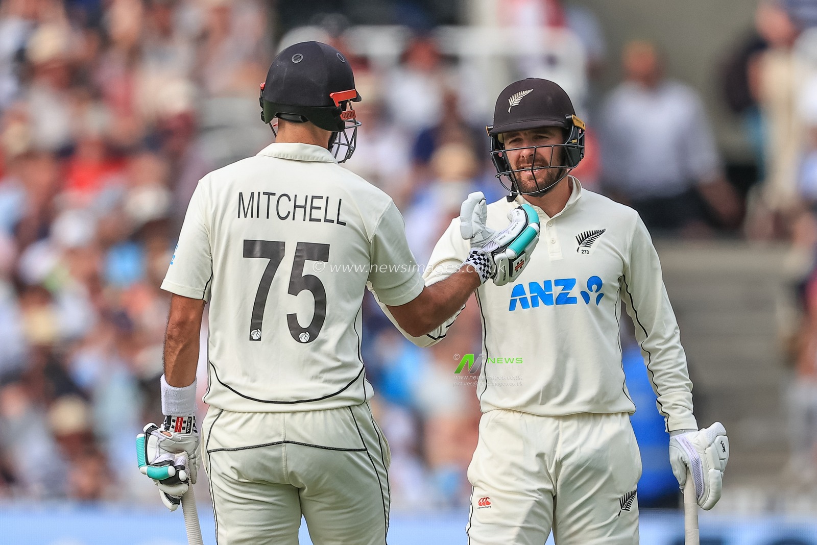 Daryl Mitchell of New Zealand celebrates a half century (50 runs) with Tom Blundell of New Zealand
