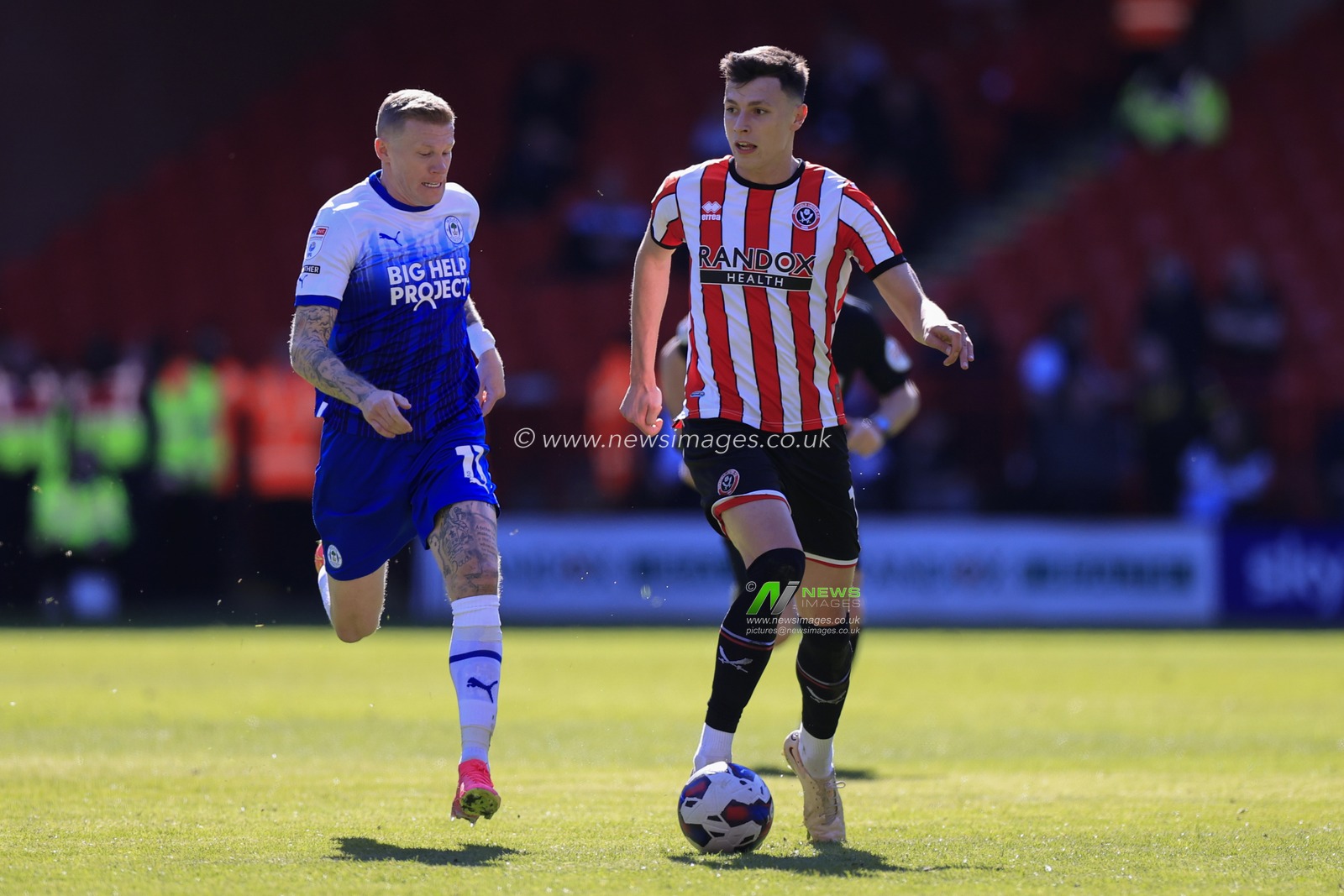 Anel Ahmedhodzic #15 of Sheffield United is chased by James McClean #11 of Wigan Athletic during the Sky Bet Championship match Sheffield United vs Wigan Athletic at Bramall Lane, Sheffield, United Kingdom, 7th April 2023

(Photo by Conor Molloy/News Images)