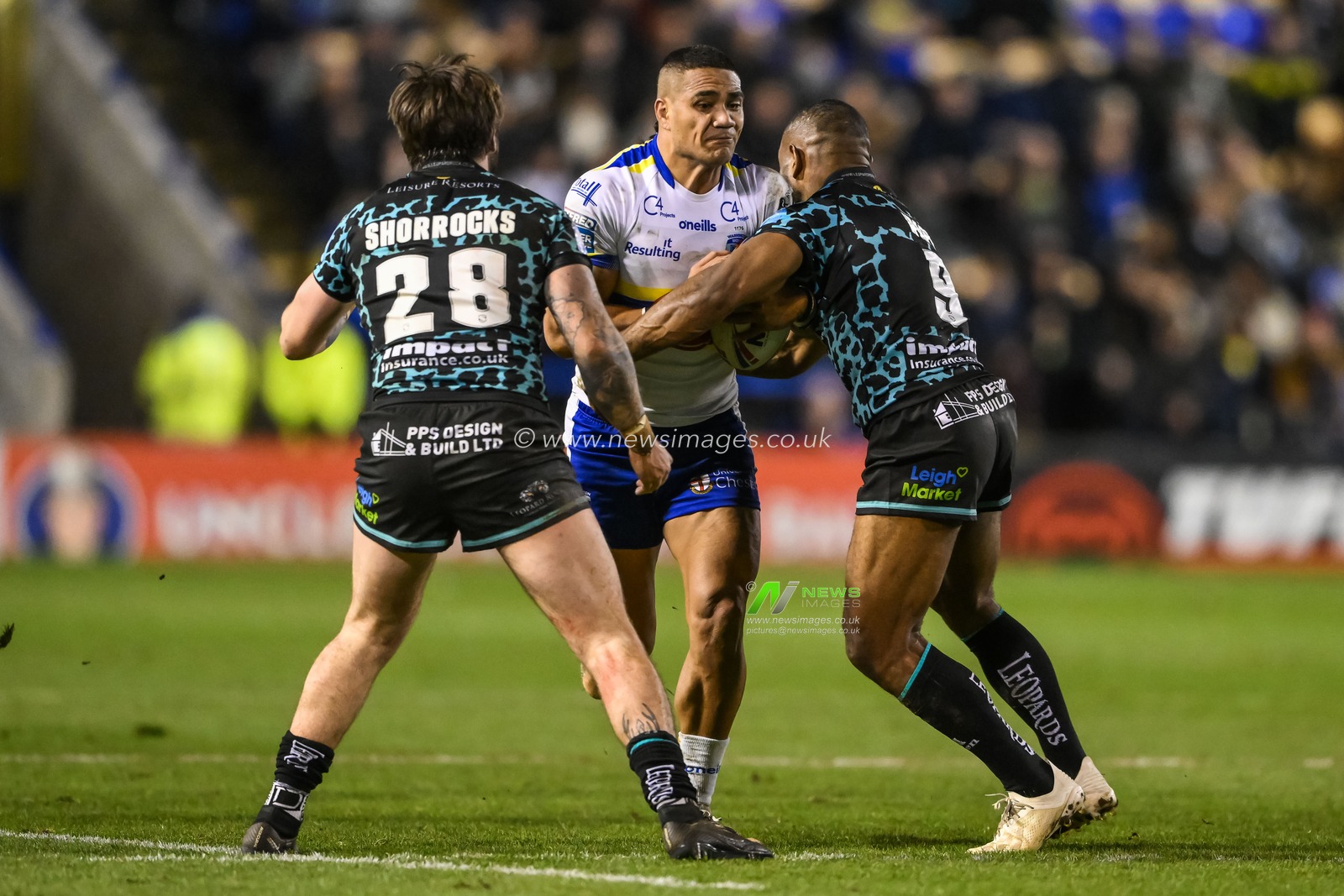 Pete Mataâ€™utia #3 of Warrington Wolves is tackled by Edwin Ipape #9 of Leigh Leopards during the Betfred Super League Round 5 match Warrington Wolves vs Leigh Leopards at Halliwell Jones Stadium, Warrington, United Kingdom, 17th March 2023

(Photo by Craig Thomas/News Images)