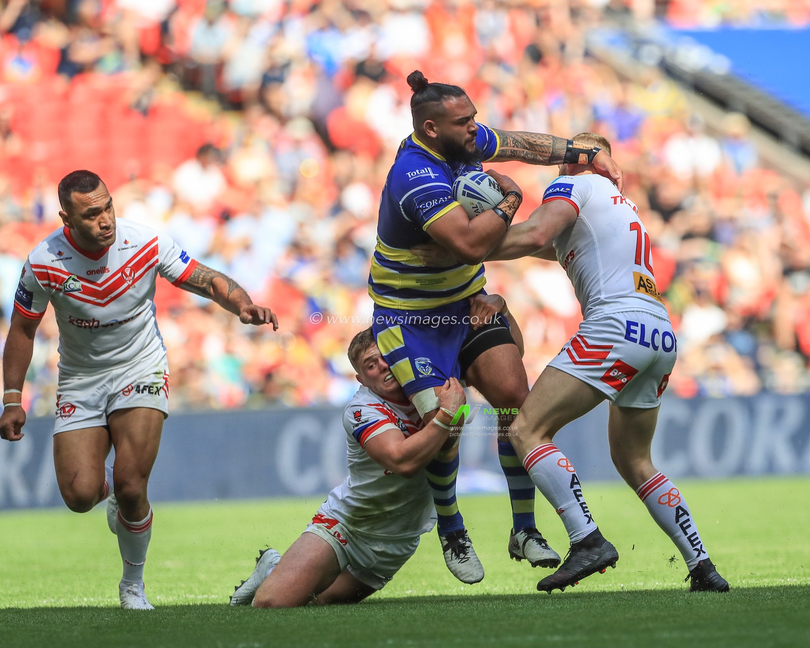 24th August 2019 , Wembley Stadium, London England ; 2019 Coral Challenge Cup Final ; St Helens vs Warrington Wolves ; Ben Murdoch-Masila of Warrington Wolves is tackled by Luke Thompson (10) of St Helens 



Credit: Mark Cosgrove/News Images