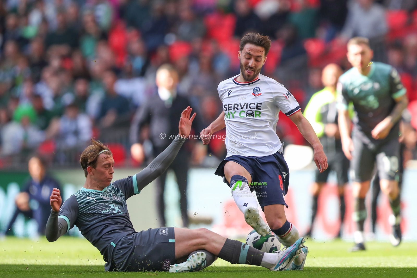 Callum Wright #26 of Plymouth Argyle tackles Josh Sheehan #8 of Bolton Wanderers during the Papa John's Trophy Final match Bolton Wanderers vs Plymouth Argyle at Wembley Stadium, London, United Kingdom, 2nd April 2023

(Photo by Gareth Evans/News Images)