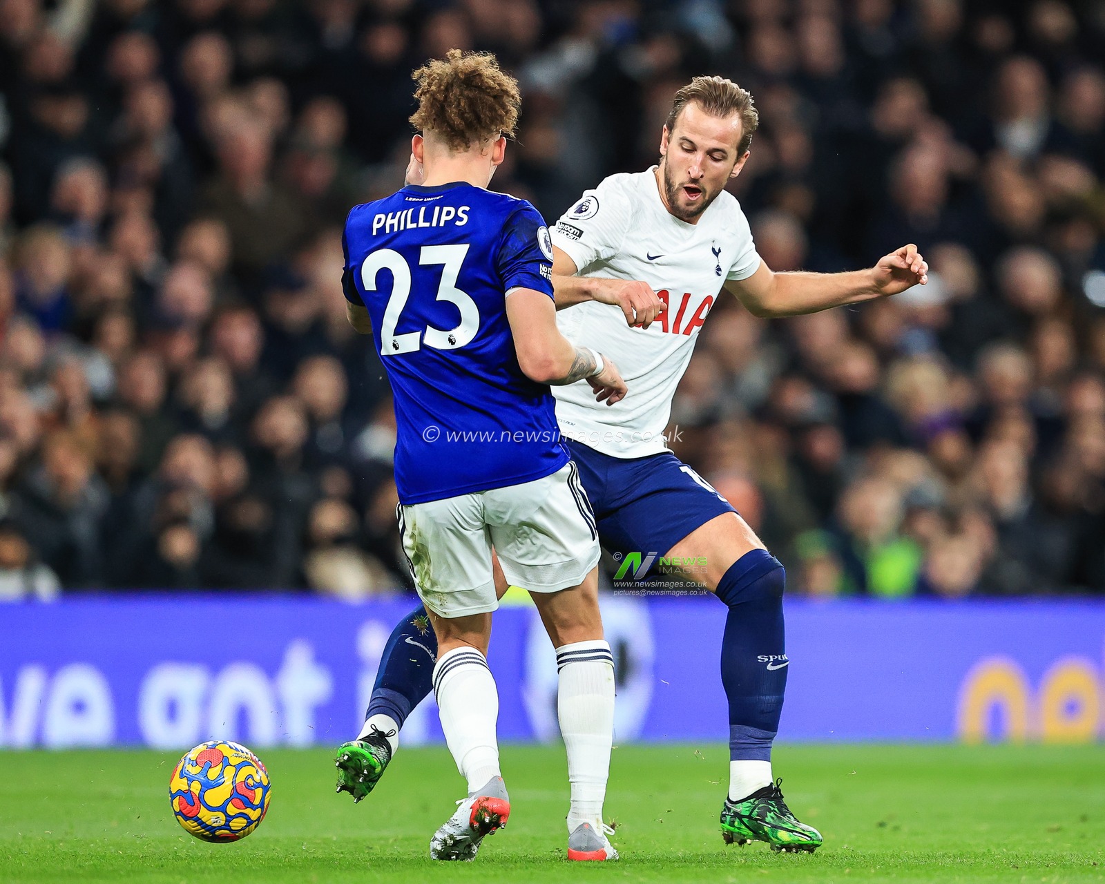 Harry Kane #10 of Tottenham Hotspur is tackled by Kalvin Phillips #23 of Leeds United
