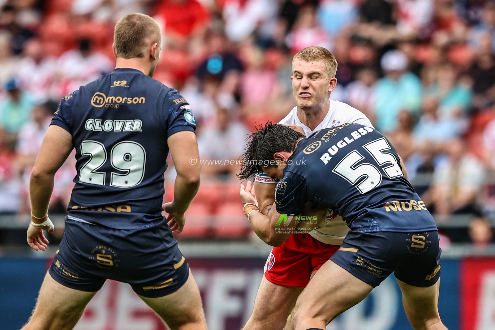 George Delaney of St. Helens is tackled during the Betfred Super League round 16 match St Helens vs Salford Red Devils at Totally Wicked Stadium, St Helens, United Kingdom, 29th June 2025

(Photo by Alfie Cosgrove/News Images)