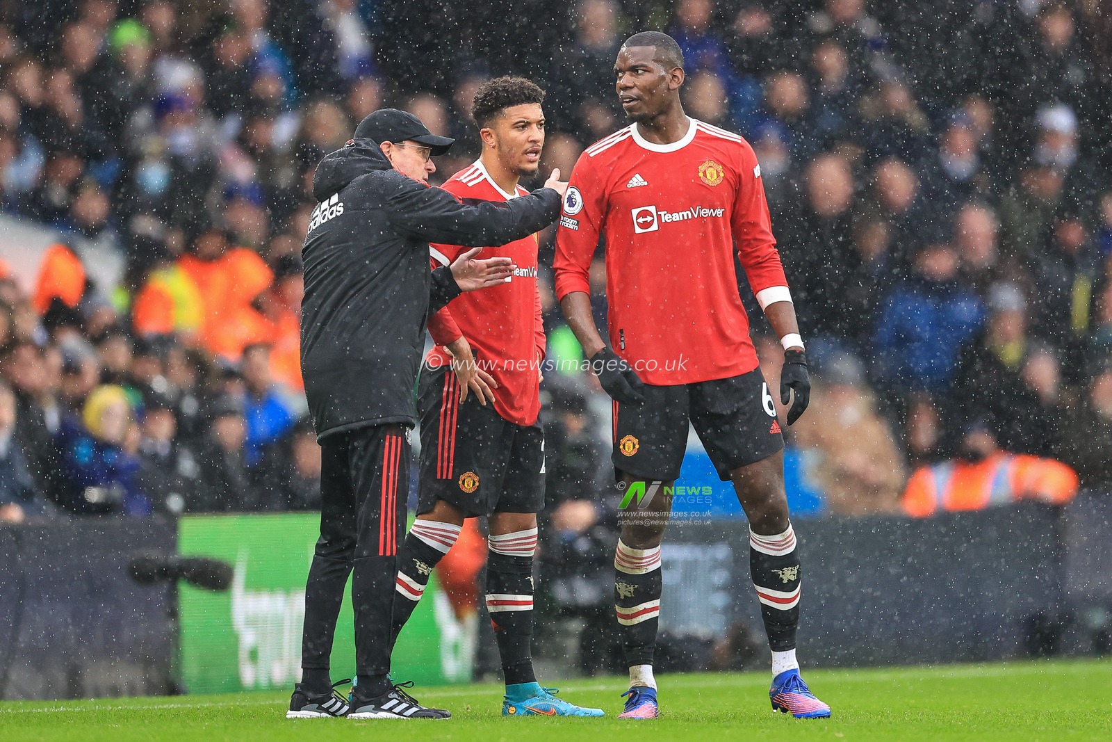 Ralf Rangnick manager of Manchester United gives his team instructions Paul Pogba #6 and Jadon Sancho #25