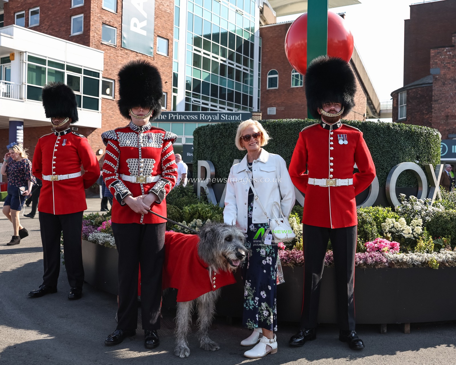 A racegoer has a photo with Kings Guard and their dog during the Randox Grand National 2025 Day 1 Opening Day at Aintree Racecourse, Liverpool, United Kingdom, 3rd April 2025

(Photo by Mark Cosgrove/News Images)