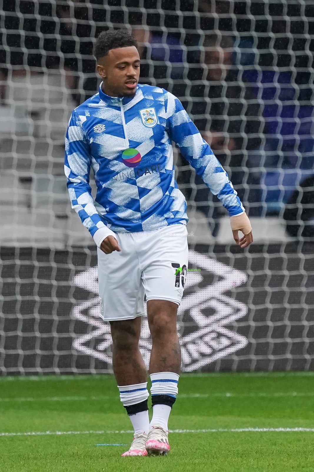 Josh Koroma #10 of Huddersfield Town warming up