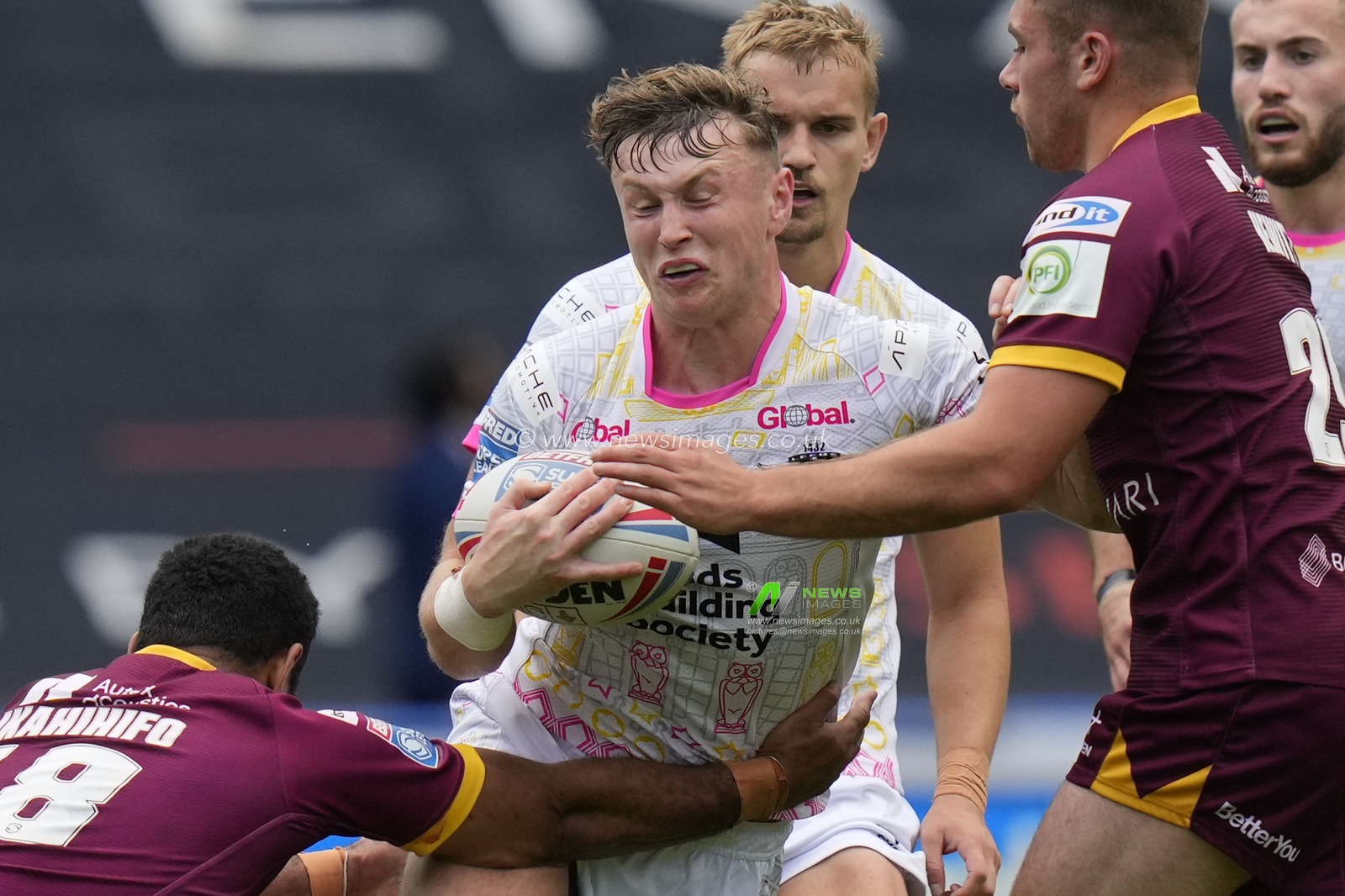 Harry Newman #3 of Leeds Rhinos is tackled by Seb Ikahihifo #18 of Huddersfield Giants during the Betfred Super League Round 23 match Huddersfield Giants vs Leeds Rhinos at John Smith's Stadium, Huddersfield, United Kingdom, 27th August 2023

(Photo by Steve Flynn/News Images)