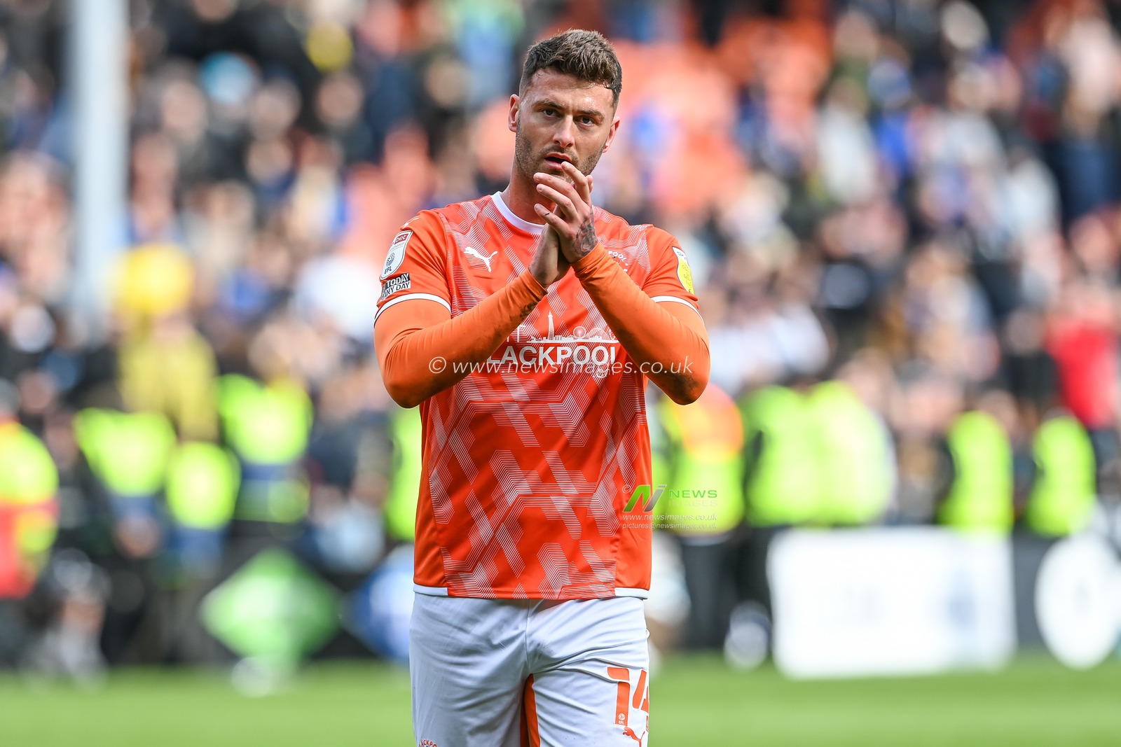 Gary Madine #14 of Blackpool applauds the fans at the end of the game