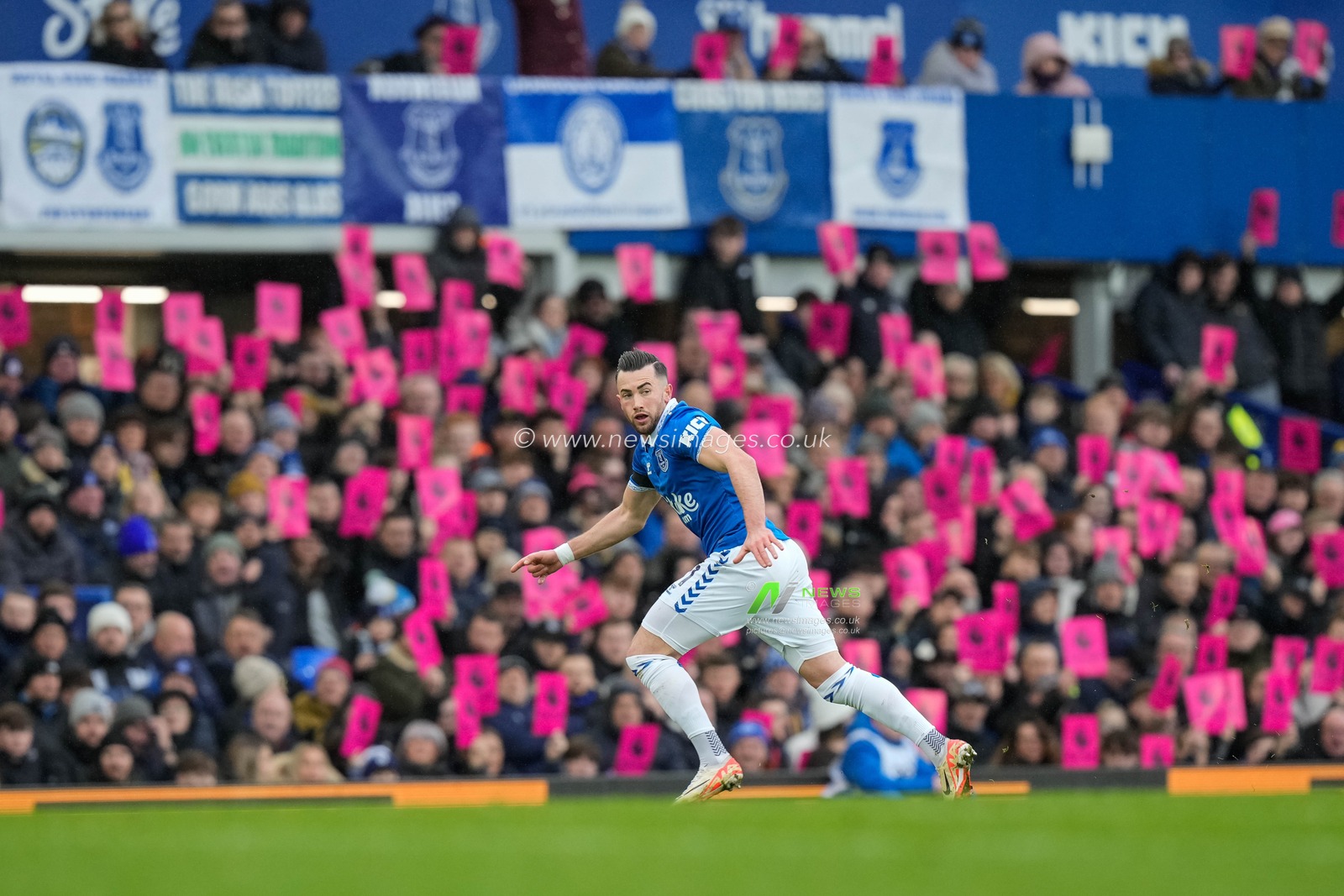 Jack Harrison of Everton in action as fans protest in the background during the Premier League match Everton vs Aston Villa at Goodison Park, Liverpool, United Kingdom, 14th January 2024

(Photo by Steve Flynn/News Images)