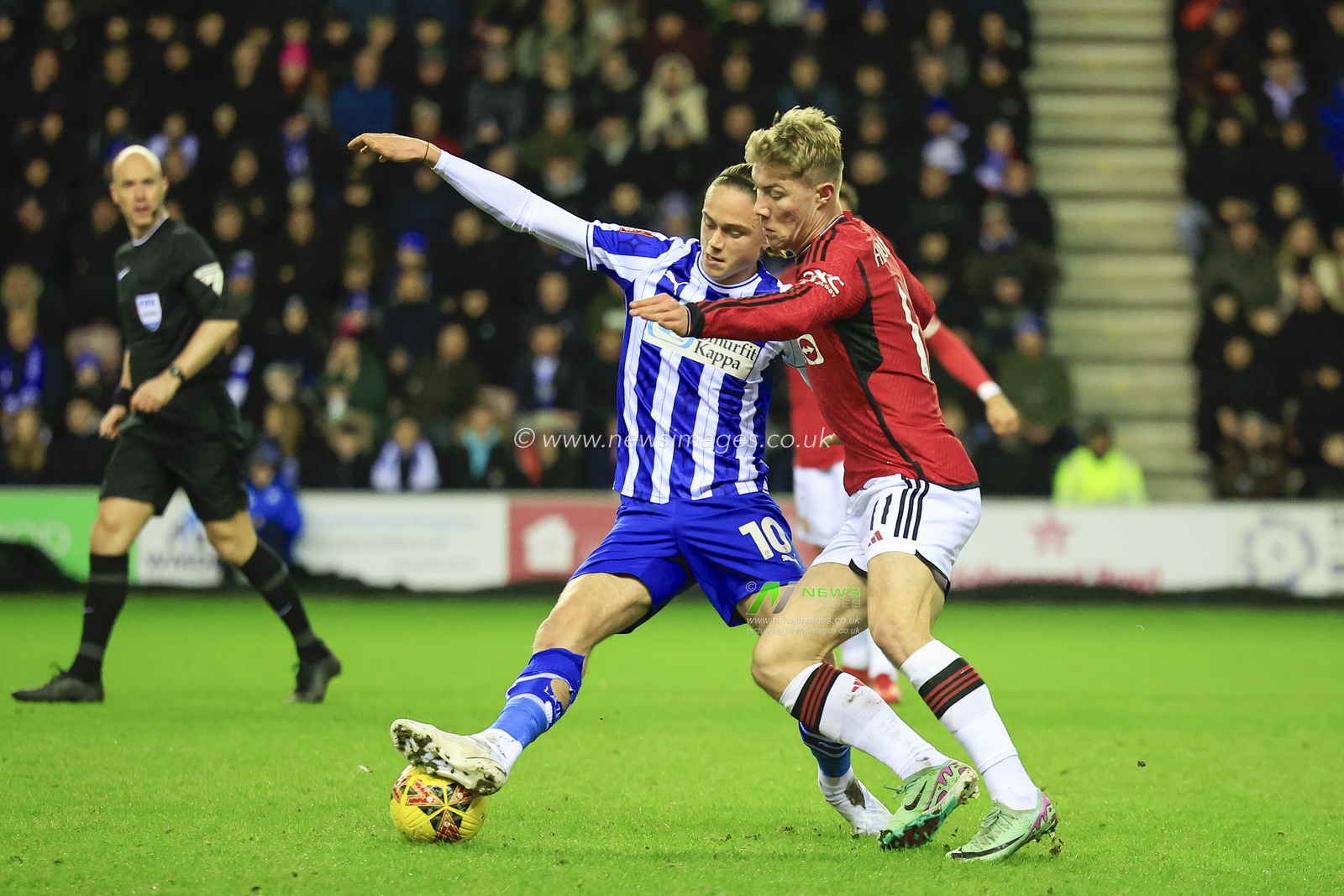 Thelo Aasgaard of Wigan Athletic and Rasmus Hojlund of Manchester United challenge for the ball during the Emirates FA Cup Third Round match Wigan Athletic vs Manchester United at DW Stadium, Wigan, United Kingdom, 8th January 2024

(Photo by Conor Molloy/News Images)
