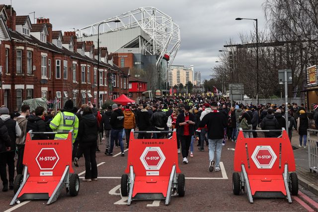 Manchester United fans make their way to Old Trafford during the Premier League match Manchester United vs Crystal Palace at Old Trafford, Manchester, United Kingdom on 01 March 2026

(Photo by Mark Cosgrove/News Images)