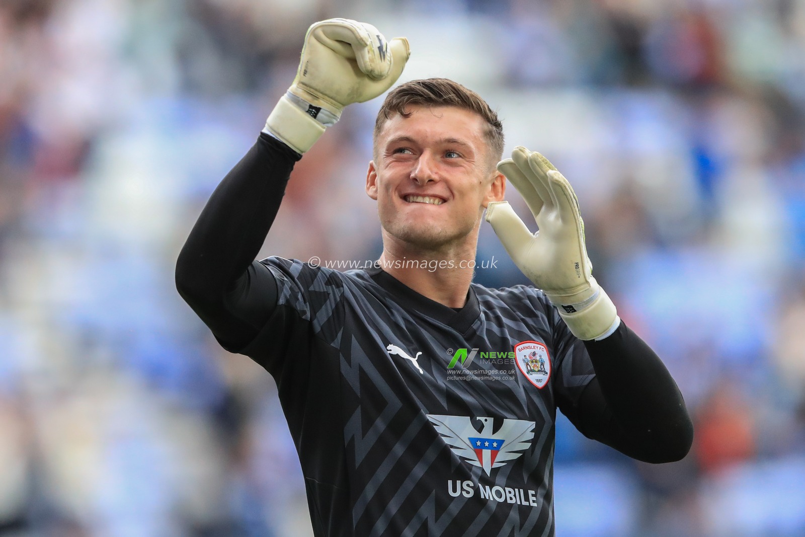 Liam Roberts #1 of Barnsley celebrates with the away fans after Barnsley win 0-2 during the Sky Bet League 1 match Wigan Athletic vs Barnsley at DW Stadium, Wigan, United Kingdom, 26th August 2023

(Photo by Alfie Cosgrove/News Images)
