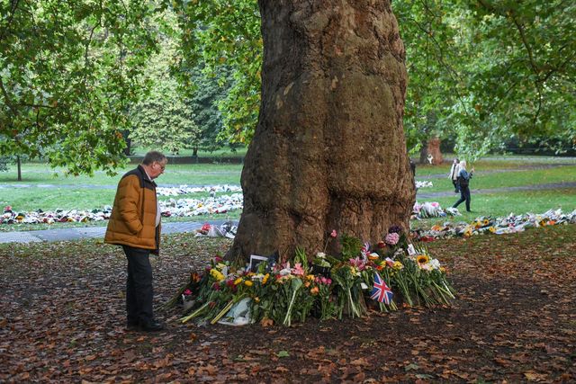 Mourners pay their respects at Buckingham Palace after the passing of Her Majesty The Queen