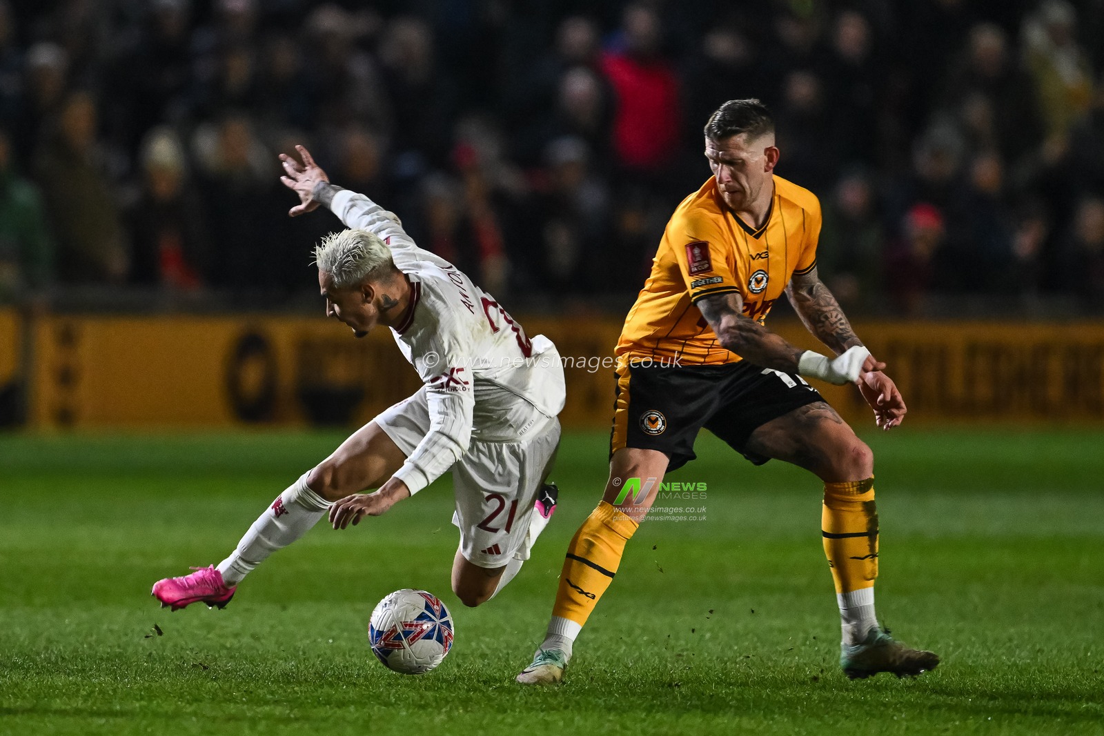 Antony of Manchester United is fouled by Scot Bennett of Newport County during the Emirates FA Cup Fourth Round match Newport County vs Manchester United at Rodney Parade, Newport, United Kingdom, 28th January 2024

(Photo by Craig Thomas/News Images)