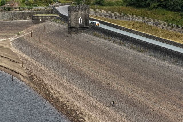 Yorkshire Water staff check water levels at Langsett Reservoir which are at a all time low as the summer drought continues at Langsett Reservoir, Barnsley, United Kingdom, 18th July 2025

(Photo by Mark Cosgrove/News Images)