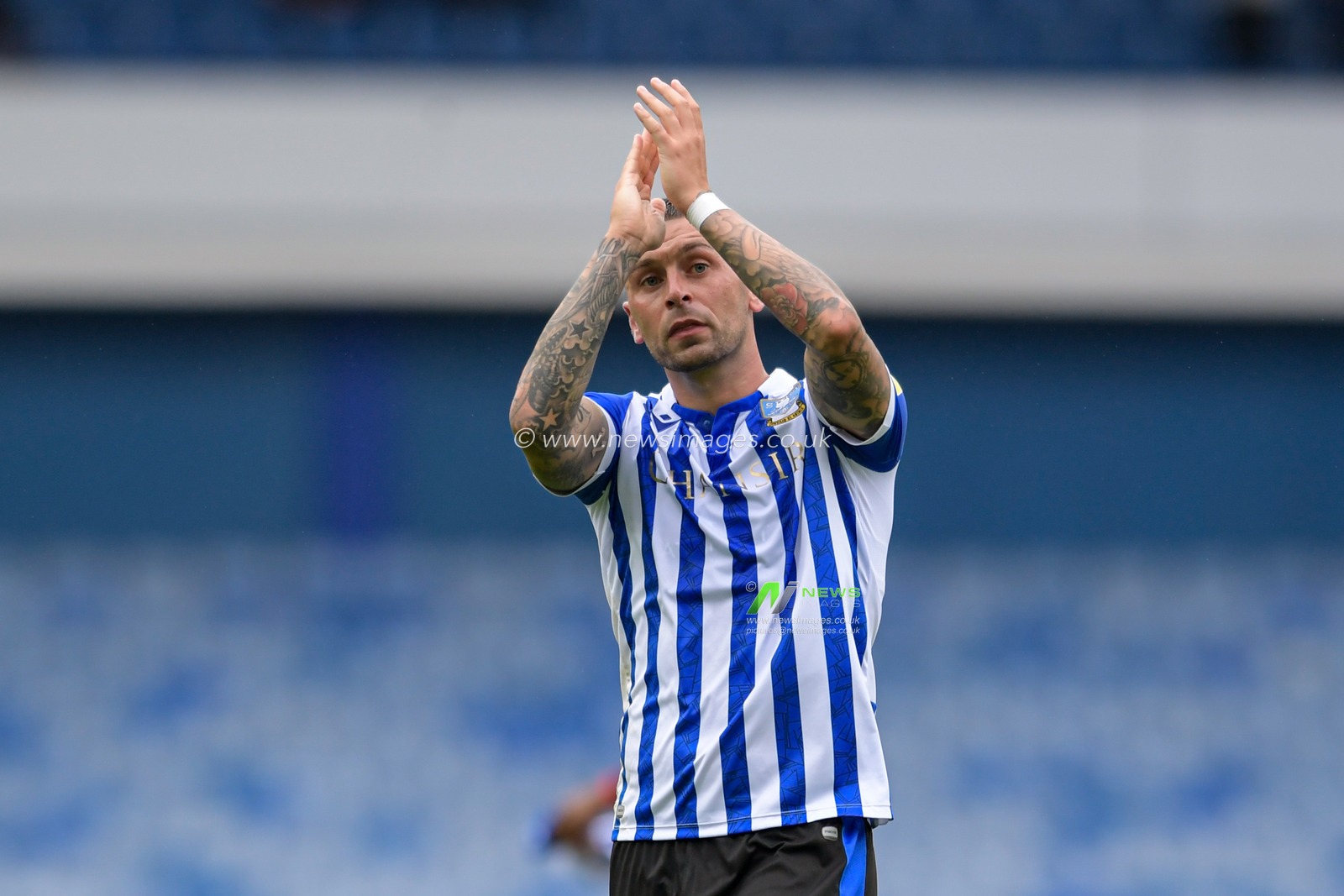 Jack Hunt #32 of Sheffield Wednesday applauds the home supporters at the end of the game