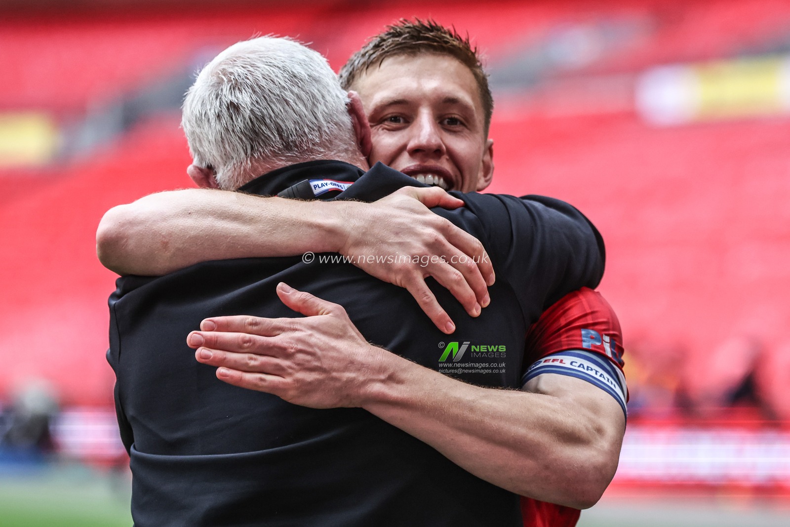 Greg Docherty of Charlton Athletic celebrates with Terry Smith (commentator at Charlton Athletic) during the Sky Bet League 1 Playoff Final match Charlton Athletic vs Leyton Orient at Wembley Stadium, London, United Kingdom, 25th May 2025

(Photo by Alfie Cosgrove/News Images)