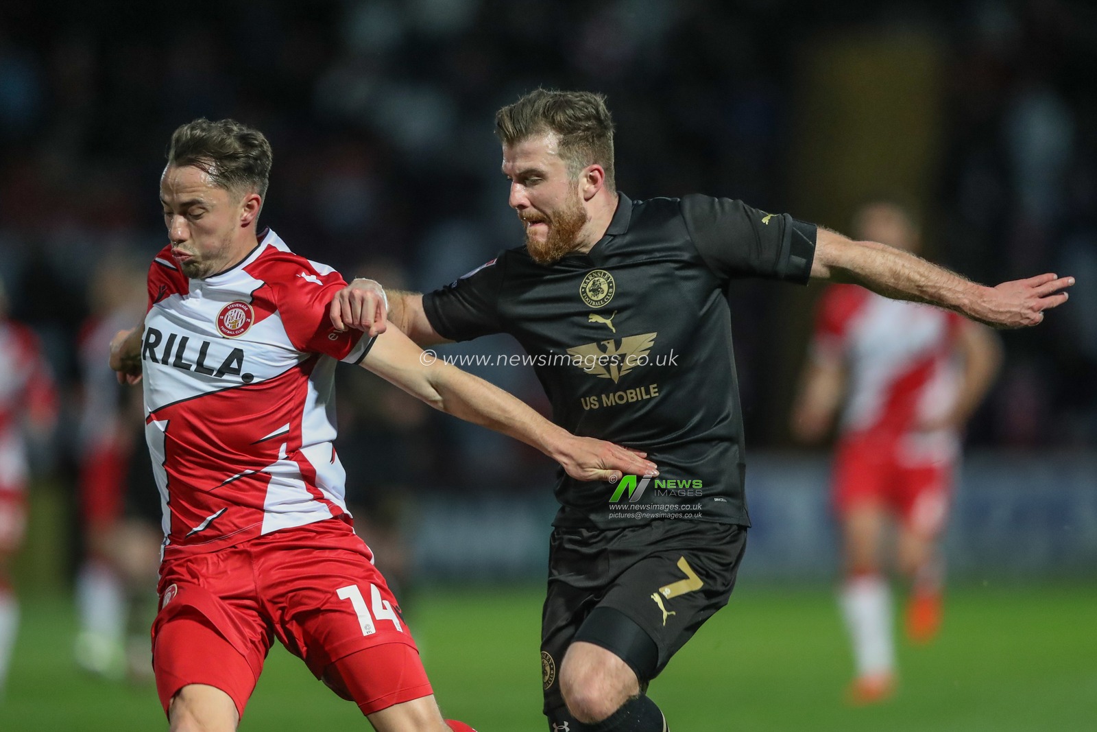 Nicky Cadden of Barnsley and Kane Smith of Stevenage battle for the ball during the Sky Bet League 1 match Stevenage vs Barnsley at Lamex Stadium, Stevenage, United Kingdom, 9th April 2024

(Photo by Alfie Cosgrove/News Images)