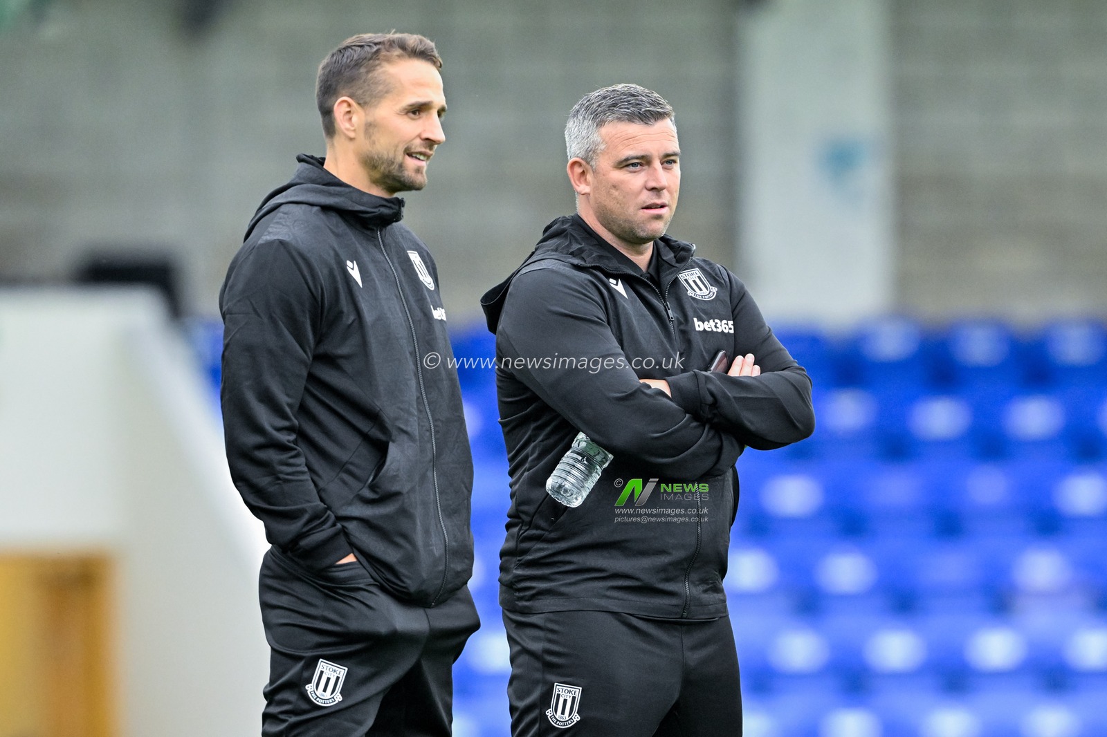 Steven Schumacher manager of Stoke City speaks with Paul Gallagher first-team coach of Stoke City ahead of the Pre-season friendly match Chester vs Stoke City at Deva Stadium, Chester, United Kingdom, 11th July 2024

(Photo by Cody Froggatt/News Images)